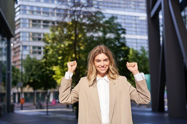 portrait-of-successful-business-woman-young-corporate-woman-celebrating-victory-achievement-triumphi_1258-125254